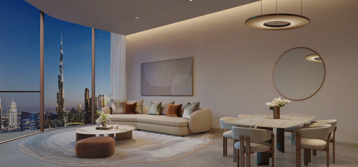 Living and dining room at dusk with curved glass facing Burj Khalifa