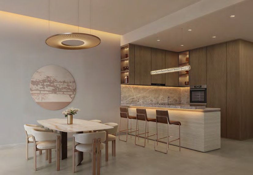 Oak kitchen with breakfast bar beside a stone dining table