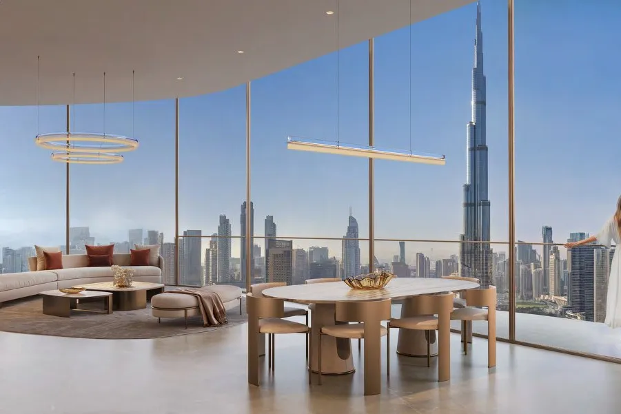 Wide living and dining space with floor-to-ceiling windows onto the skyline